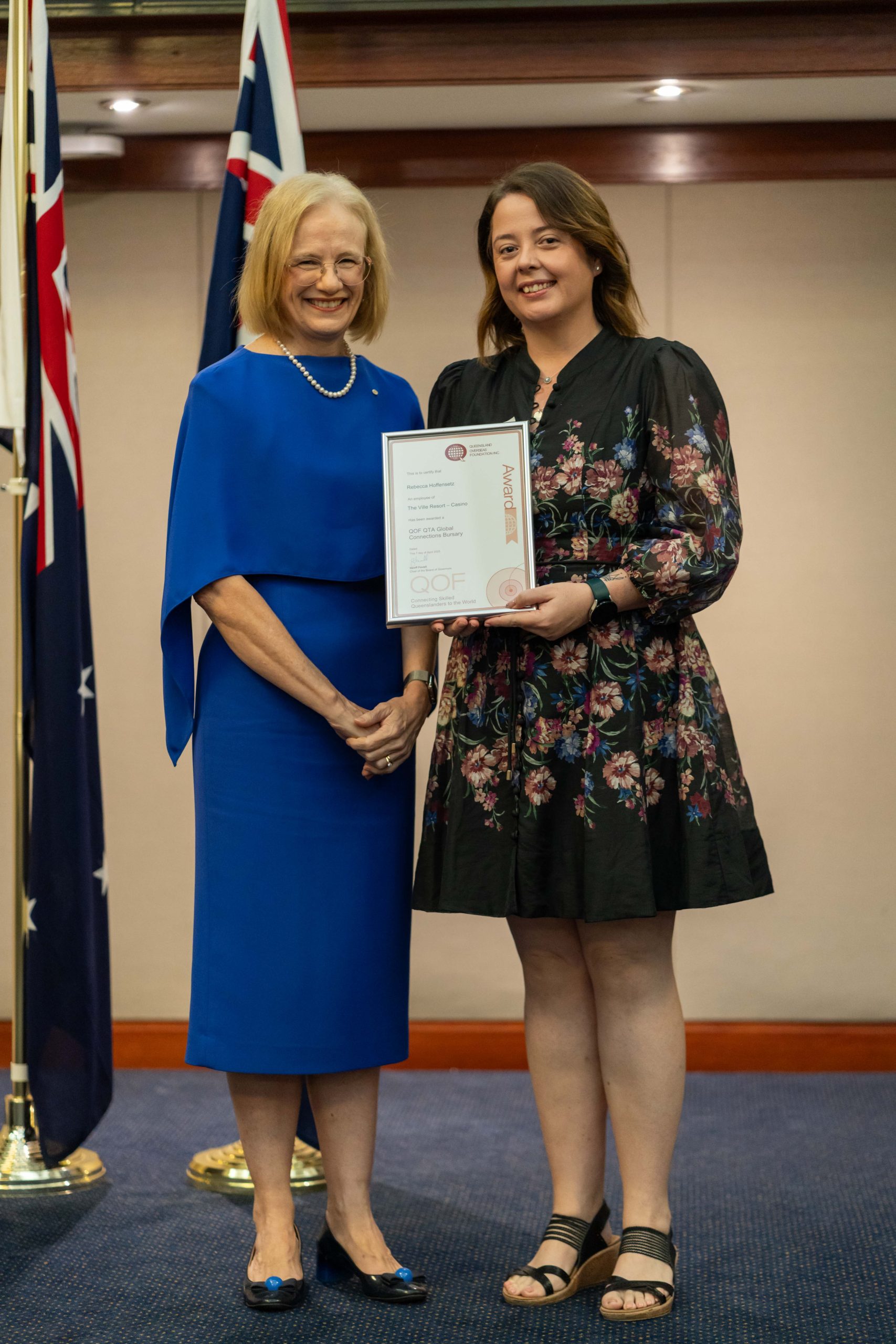 The governor of Queensland with Rebecca Hoffensetz smiling with her certificate