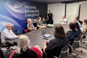 A boardroom of people attending a seminar
