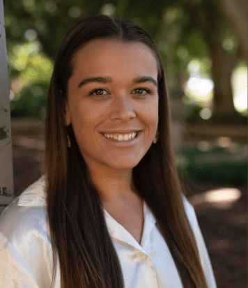 Abbey Wright smiling headshot outside