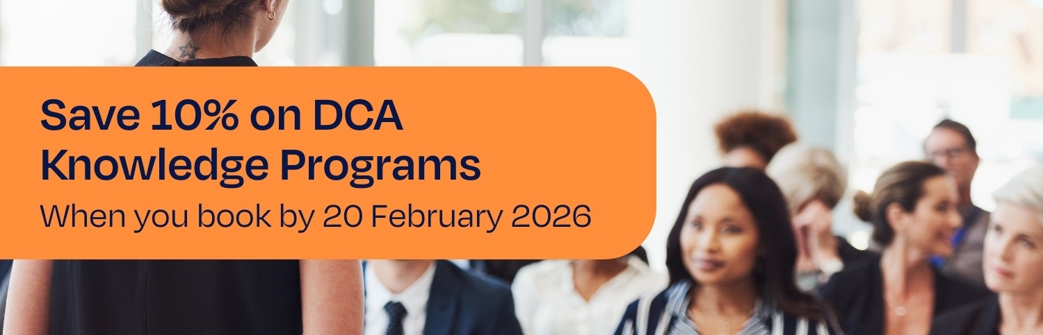 Blurred people in office clothing sitting in front of a standing woman speaking to them. Save 10% on DCA Knowledge Programs when you book by 20 February 2026.