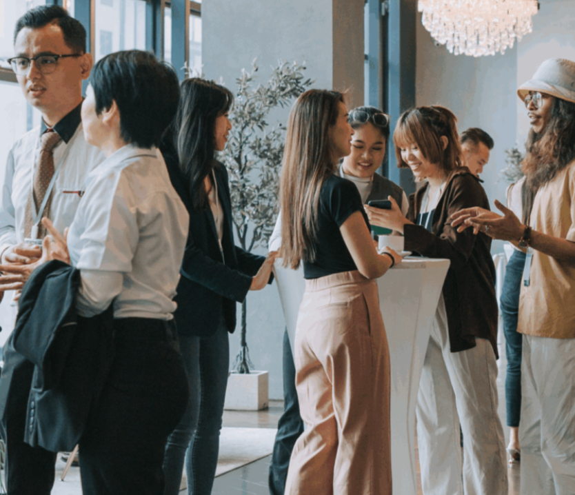 People standing and talking at a social event
