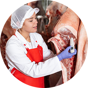 woman inspecting meat