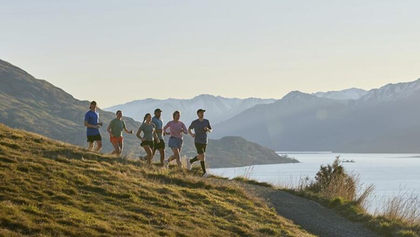 People running on a hill